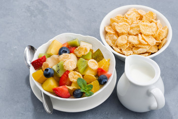 bowl of fresh fruit salad with corn flakes