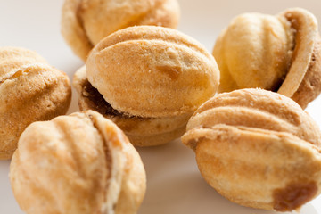 Homemade cakes in shape of nut with condensed milk