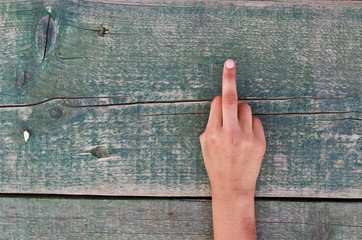 hand, numbers and wood