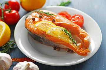 Fish with vegetables on plate
