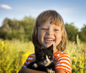 Happy kid with a kitten