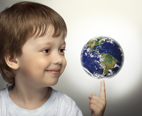happy boy with panet Earth in hand. Elements of this image furnished by NASA.