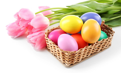 Obraz na płótnie Canvas Multicoloured Easter eggs and tulips isolated on white