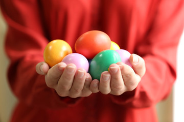 Female hands holding Easter eggs