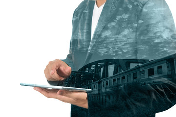 Double Exposure of Business Man use Tablet and Train over Railwa