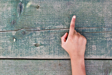 hand, numbers and wood