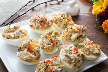stuffed eggs with peppers, mushrooms and herbs - selective focus - obrazy, fototapety, plakaty