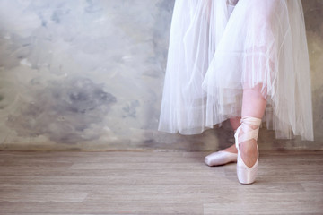 Fototapeta na wymiar Legs of a ballerina in pointe shoes, lifestyle, hobbies, dancing, choice