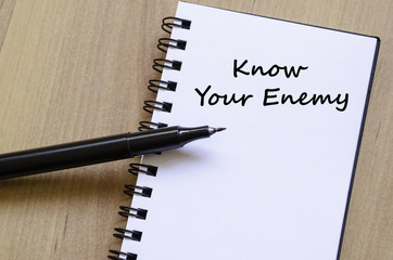 Know your enemy write on notebook - 105838918