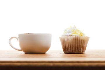Cup of Coffee and muffin isolated on white