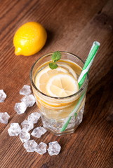 glass of lemonade with ice on table