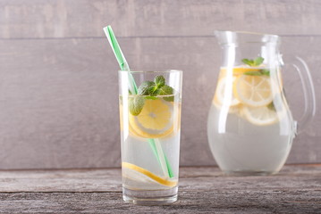glass and carafe with lemonade