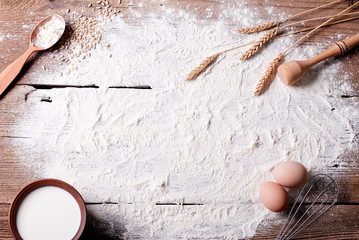 flour on the table and ingredients - obrazy, fototapety, plakaty