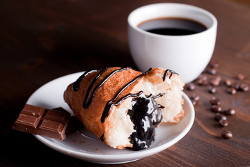 croissant with chocolate and coffee