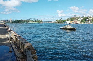 Fototapeta na wymiar Ballast Point Park with Harbour Bridge on Mort Bay Sydney