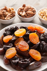 Dried fruits in a white plate with nuts