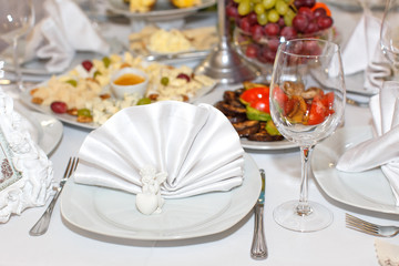 cutlery on the white banquet table in restaurant