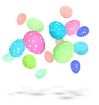 Brightly painted Easter eggs with spots falling to the ground