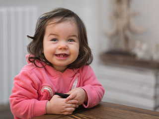 Naklejka premium Small baby laughing sincerely