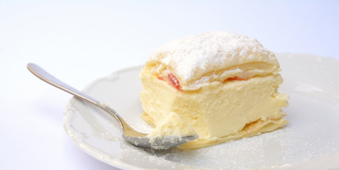 Sweet dessert of puff pastry and vanilla pudding