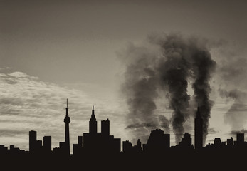Fototapeta na wymiar Silhouette of city in smoke