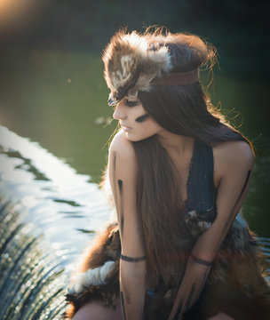 A stunningly beautiful Amazon posing on a river waterfall