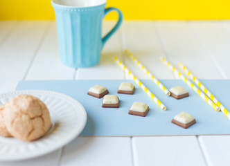 Coconut biscuits and cup of tea on napkin
