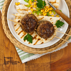 Cutlets or Sausage Patties Skewers for Dinner. Selective focus.