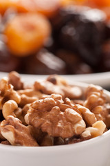 Cleaned walnuts in a white bowl closeup