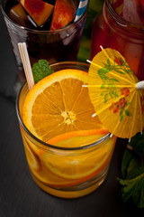 Summer Cocktails and Drinks with fruits pieces. Selective focus.