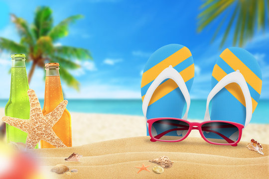 Sunglasses, juice and slippers on beach. Starfish and shells on sand. Beach and sea with palm in background.
