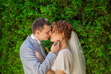 The groom kisses the bride tenderly