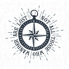Hand drawn textured vintage label, retro badge with compass rose vector illustration and "Not all those who wander are lost" inspirational lettering.