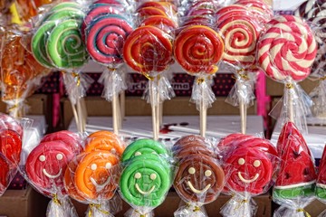 Lot of colorful sweets and lollipops at fair