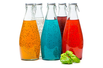 Basil Seed Drink in glass Bottles on white background