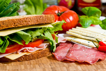 Sandwich with lettuce, tomato, ham and cheese