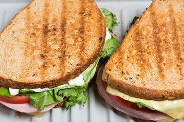 Toasted Sandwich with lettuce, tomato, ham and cheese