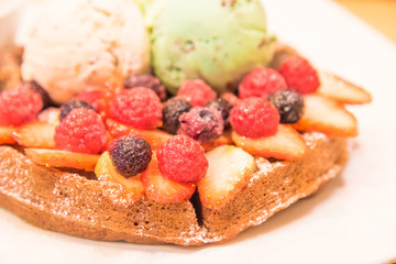 Ice in fresh Pan Cake with mixed fruits on black background