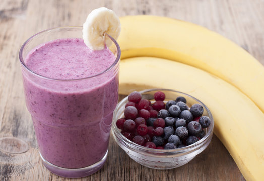Smoothie of banana, berries frozen cranberries and blueberries w