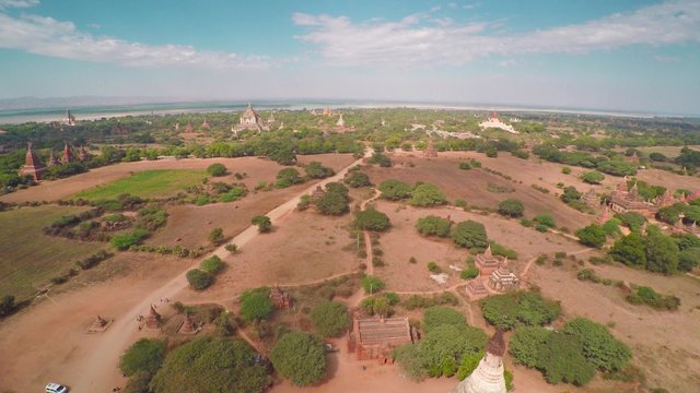 Flying over Shwesandaw Pagoda and Temples in Bagan at evening, Myanmar (Burma), 4k
