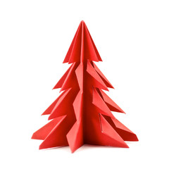 Origami Christmas tree paper isolated on white background. For decoration, Merry Christmas postcard vintage with red paper. Happy New Year. Front view. Close up.