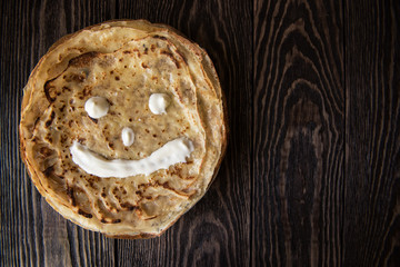 Fried tasty smiling pancakes 