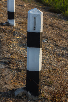 Black and white pole in wayside 