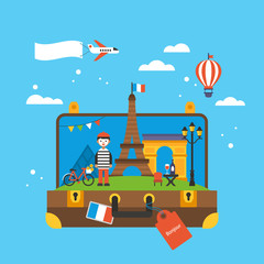Travel to Paris, France concept with landmark icons inside suitc