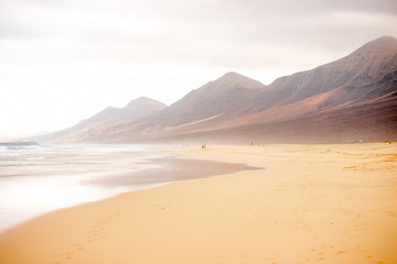 Cofete beach at the cloudy and foggy weather on Fuerteventura island in Spain
