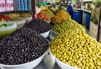 olives and oil press in the market, Morocco. Selection of pickle