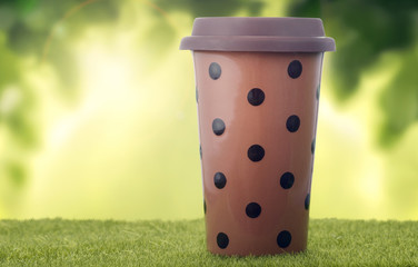 Coffee cup on the grass