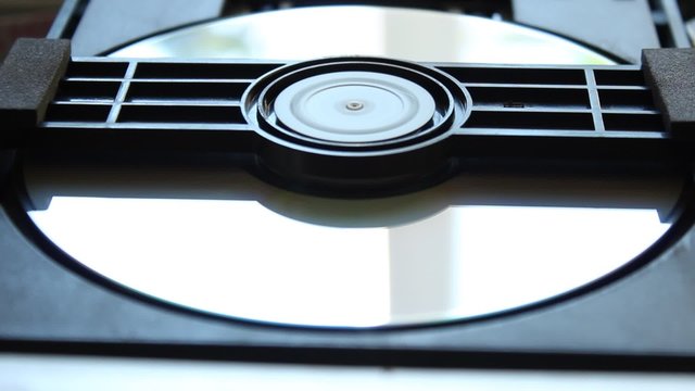 DVD player. Inside a DVD player. Download and extract the DVD disc from the player. DVD disk.