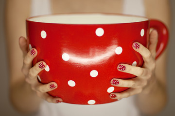 woman hands holding giant coffee cup