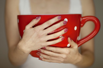 woman hands holding giant coffee cup